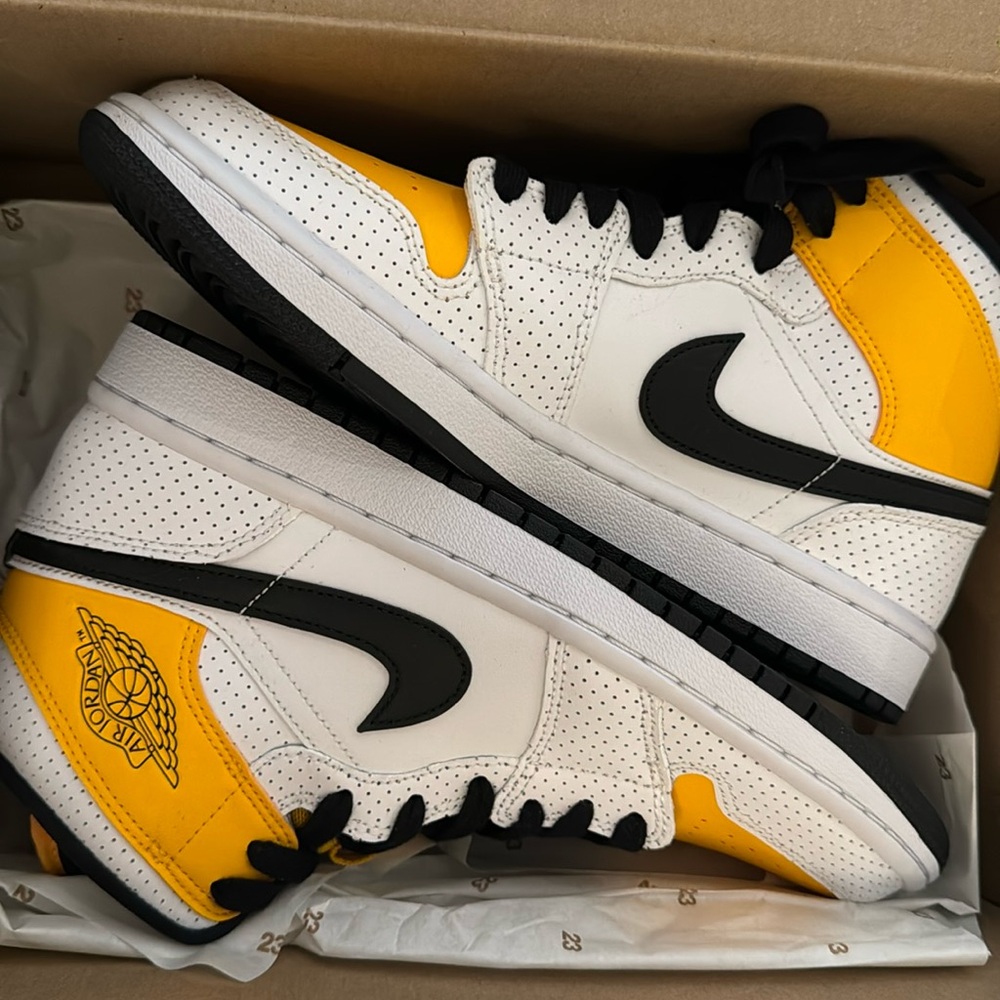 Brand new never worn in box wmns air Jordan 1 mid. White/ black-university gold.